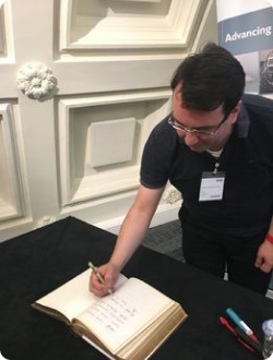 Signing the London Mathematical Society members book
